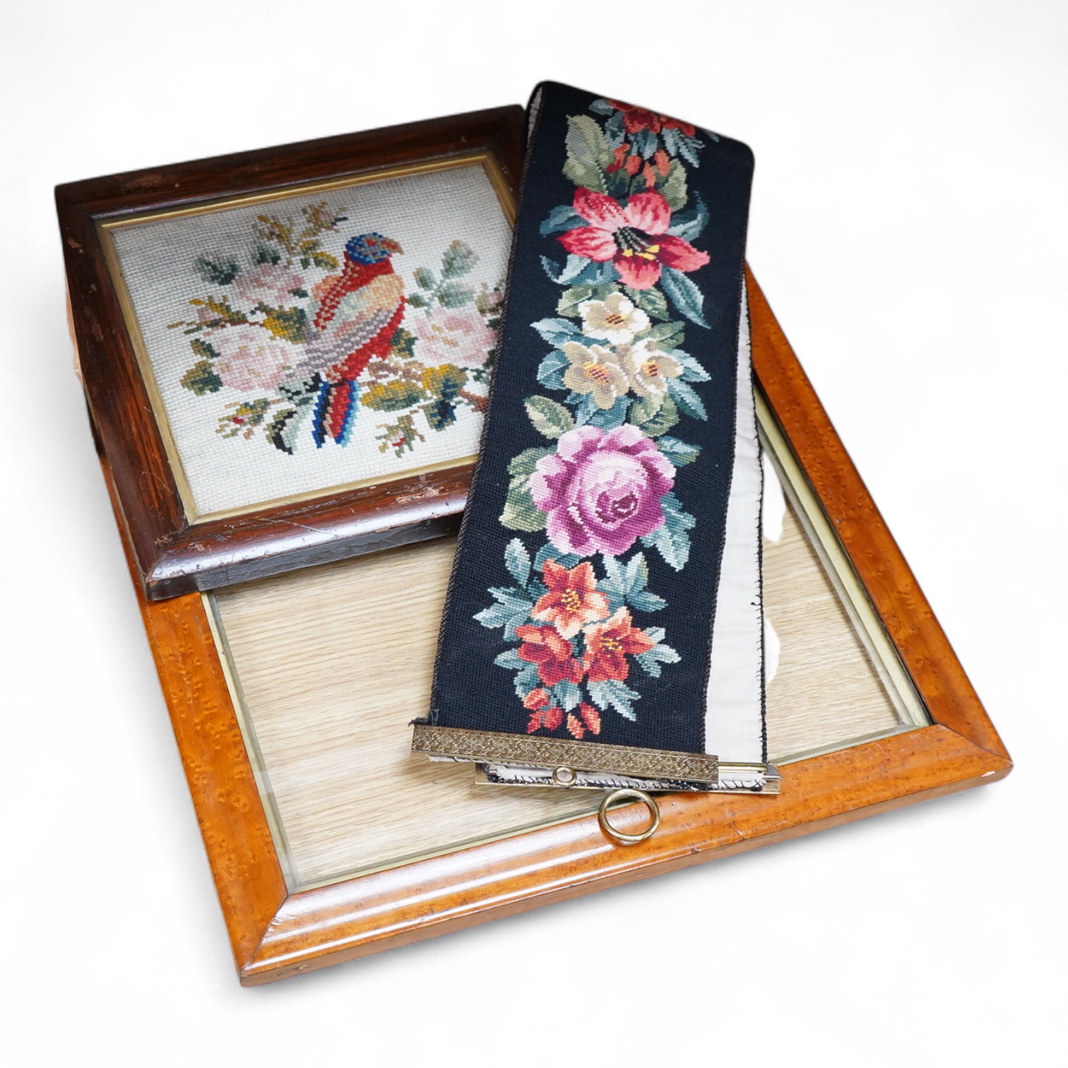 A framed 19th century woolwork embroidery of a bird, a floral wool bell pull with gilt mounts and a large maple frame